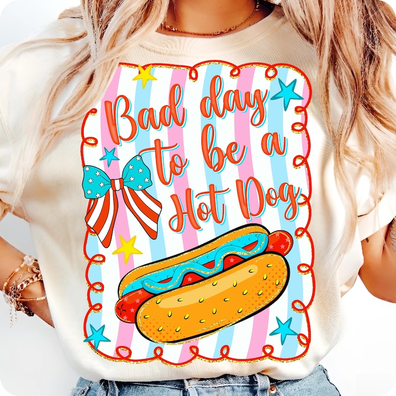 Humorous "Bad Day to be a Hotdog" PNG design with coquette American flag bow and pink and blue stripes for 4th of July sublimation.