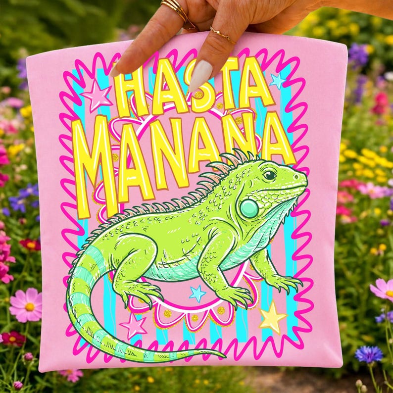 Hasta Mañana Iguana PNG design on a t-shirt, showcasing vibrant retro stripes and Spanish text