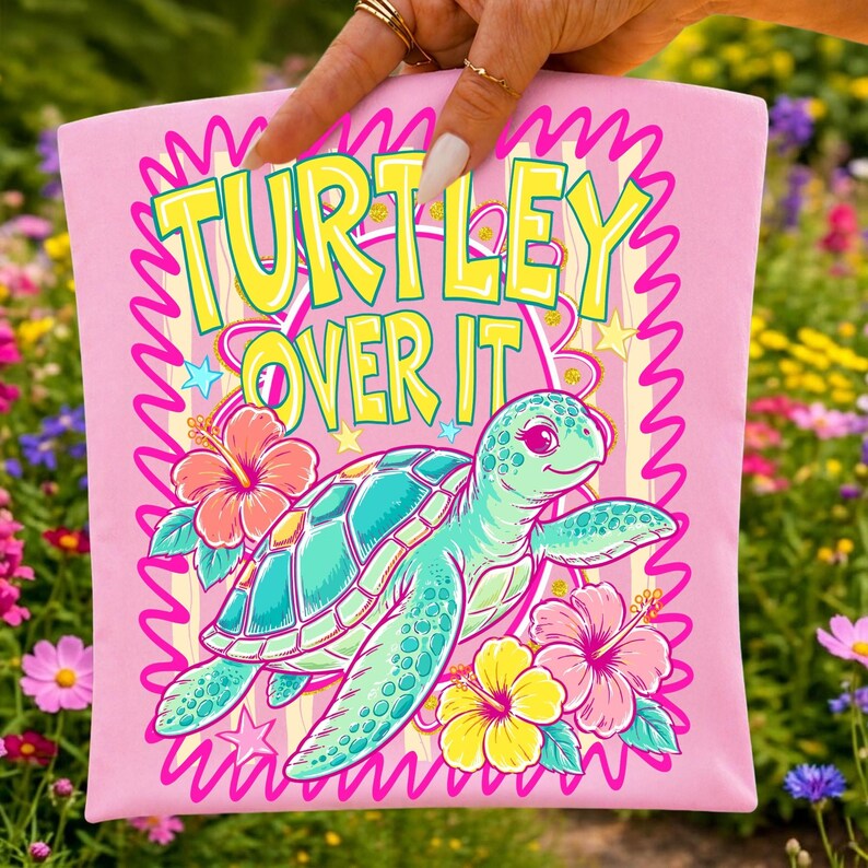 Cute sea turtle with hibiscus flowers and "Turtley Over It" quote PNG design for sublimation
