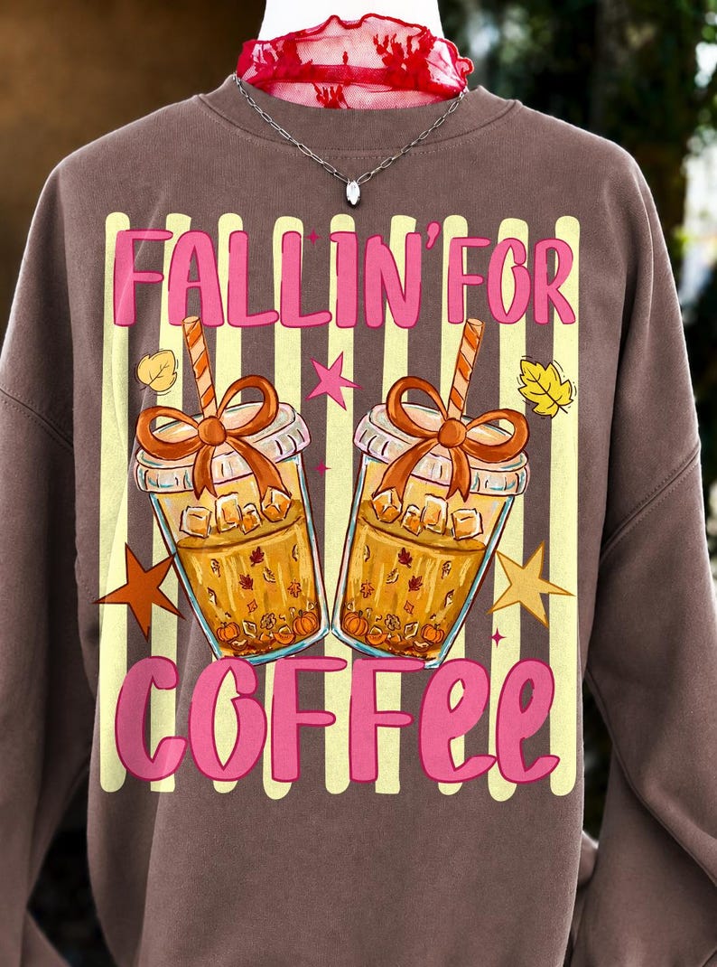 A close-up of the 'Fallin' For Coffee' PNG design featuring an iced coffee cup with a coquette bow, autumn leaves, and 'Fallin' For Coffee' text.