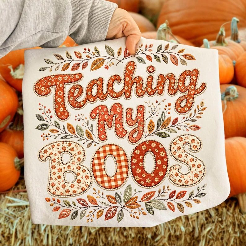 Retro floral autumn teacher shirt design featuring Teaching My Boos text