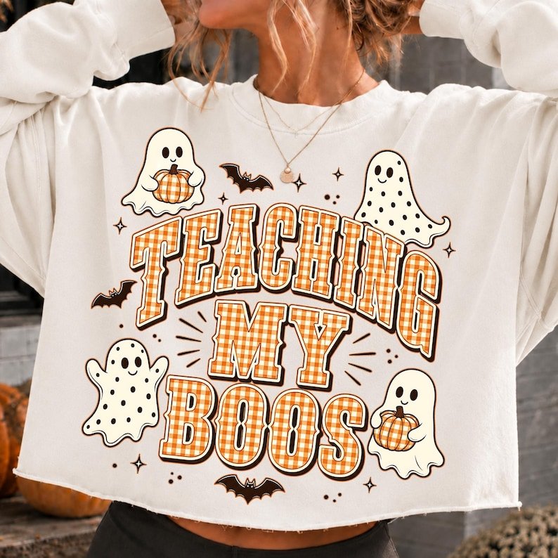 Teacher wearing a custom ghost-themed t-shirt in a classroom setting